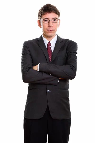 Studio shot of businessman standing with arms crossed — Stock Photo, Image