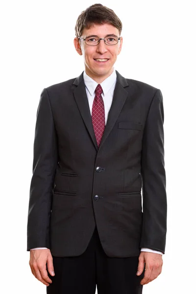 Studio shot of happy businessman smiling and wearing suit — Stock Photo, Image