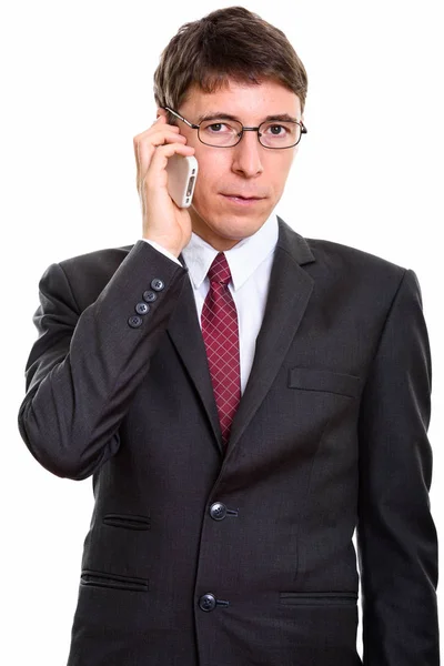 Studio shot of businessman talking on mobile phone — Stock Photo, Image