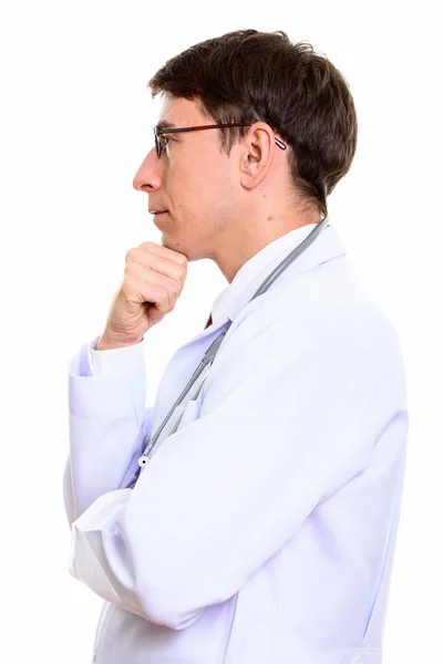 Вид профілю чоловіка лікар мислення з рукою на підборідді — стокове фото