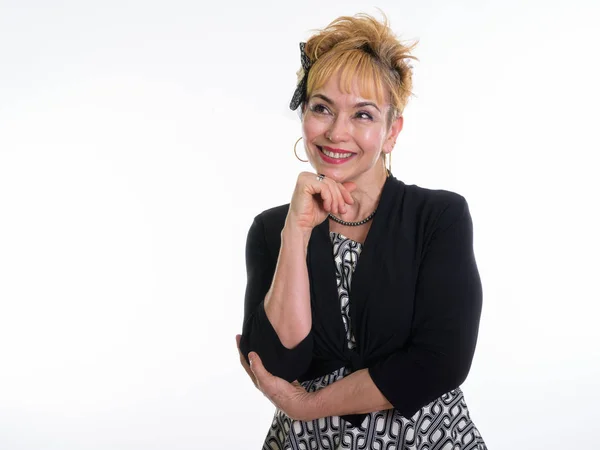 Studio shot of happy senior Asian businesswoman smiling while th — Stock Photo, Image