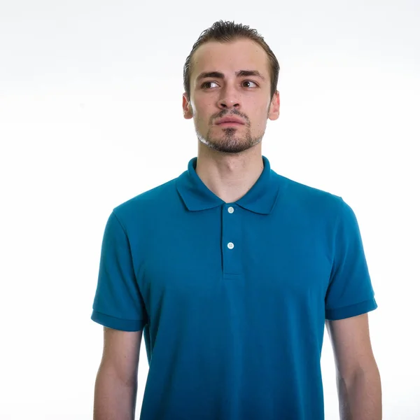 Studio shot of young bearded man thinking while looking up again — Stock Photo, Image