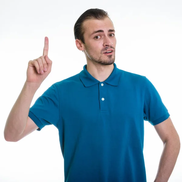 Studio záběr vousatý mladík ukazující prst proti Svatodušní — Stock fotografie