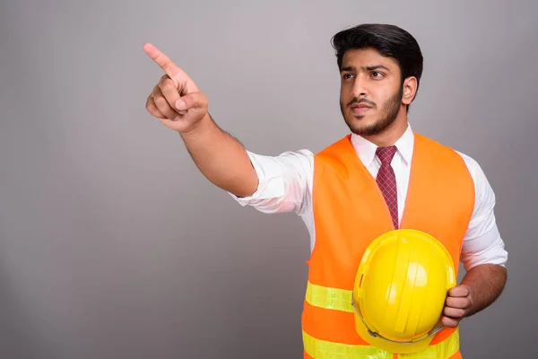 Retrato del hombre indio trabajador de la construcción empresario señalando el dedo — Foto de Stock