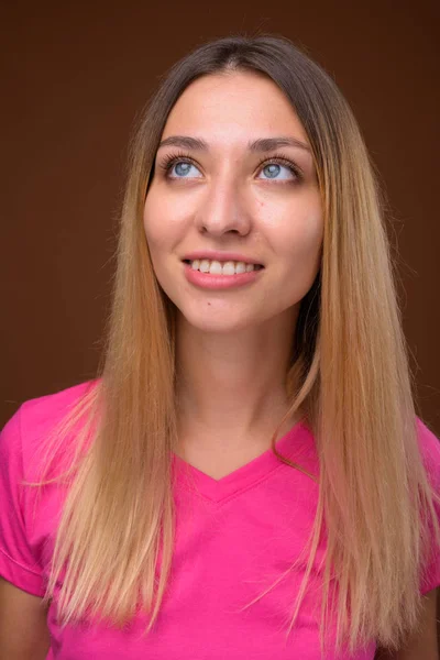 Face of happy young beautiful woman smiling and thinking — Stock Photo, Image