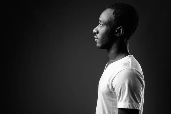 Profile view portrait of young African man in black and white