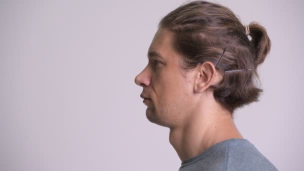 Profile view of serious handsome man looking up — Stock Video