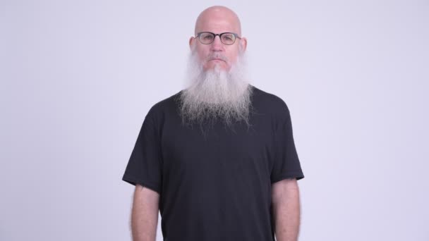 Mature bald bearded man covering ears as three wise monkeys concept — Stock Video