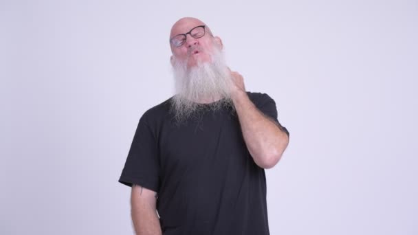 Stressed mature bald bearded man having neck pain — Stock Video