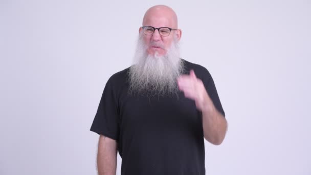 Stressed mature bald bearded man not wanting to see something — Stock Video