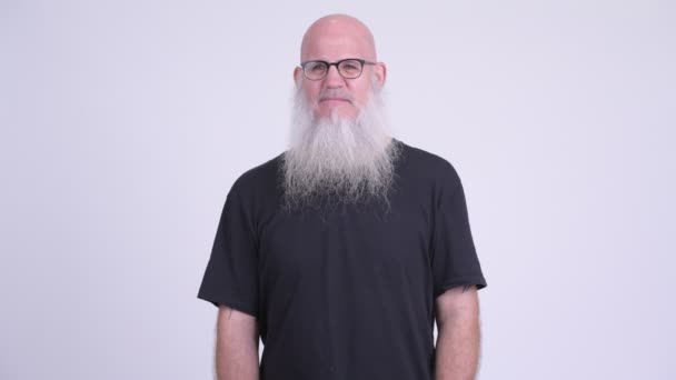 Guilty mature bald bearded man covering mouth — Stock Video