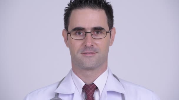 Face of happy handsome man doctor smiling while wearing eyeglasses — Stock Video