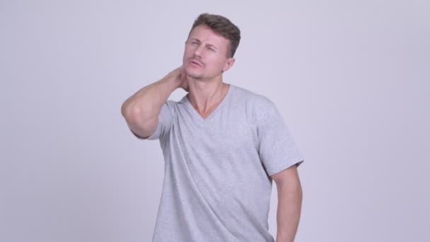 Stressed bearded man having neck pain — Stock Video