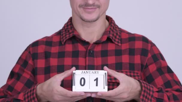 Szczęśliwy hipster Brodaty mężczyzna trzyma bloku kalendarza gotowy na nowy rok — Wideo stockowe