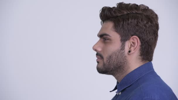 Closeup profile view of young bearded Indian businessman — Stock Video