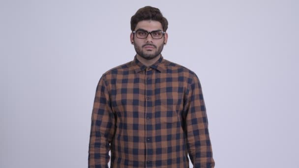 Young bearded Indian hipster man covering ears as three wise monkeys concept — Stock Video