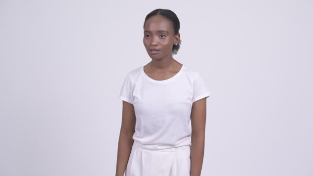 Young African woman looking shocked and stunned — Stock Video