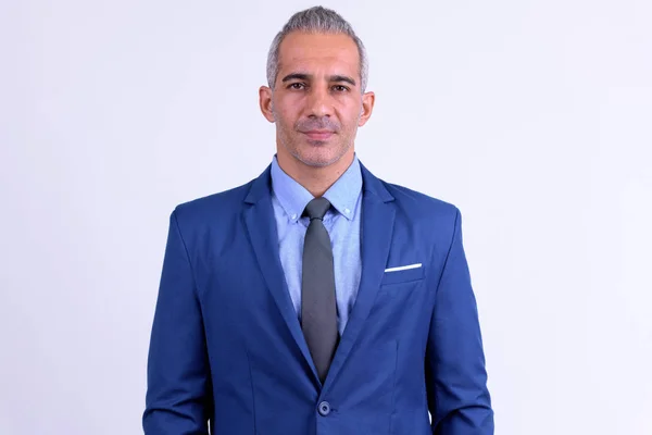 Handsome Persian businessman wearing suit against white background — Stock Photo, Image