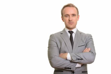 Beyaz arka plan karşı izole yakışıklı beyaz işadamı