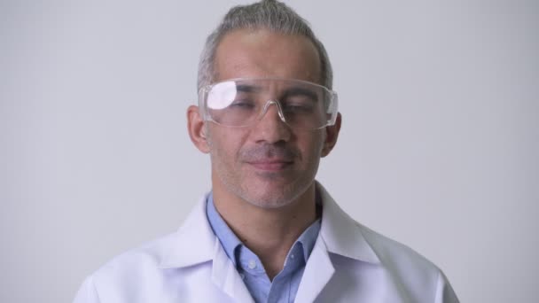 Happy Persian man doctor wearing protective glasses — Stock Video