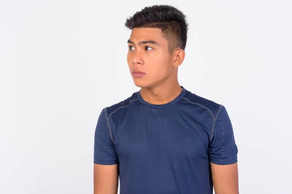 Young Asian man thinking against white background — Stock Photo, Image