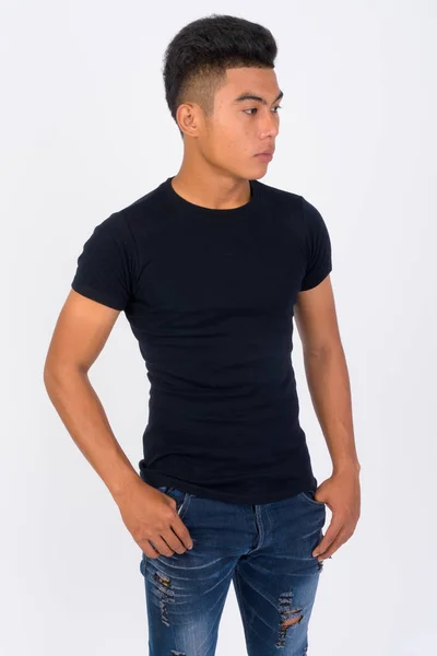 Jovem asiático homem pensando contra fundo branco — Fotografia de Stock