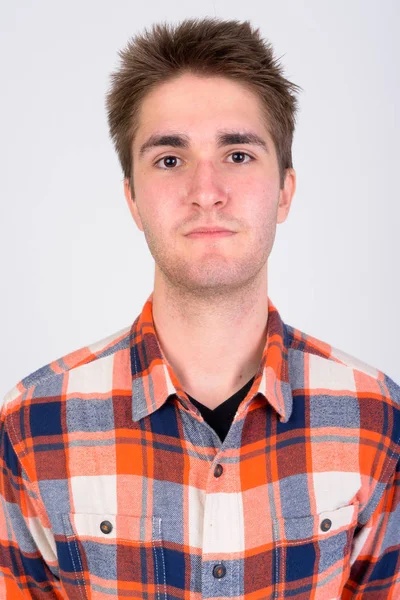Gesicht eines jungen gutaussehenden Mannes vor weißem Hintergrund — Stockfoto