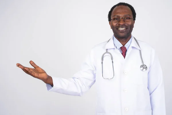 Portrait of happy African man doctor showing something — Stock Photo, Image