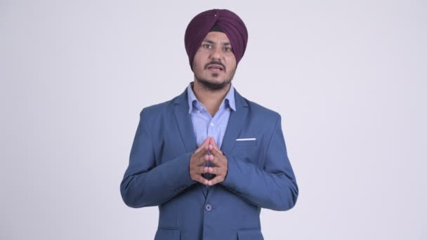 Bearded Indian Sikh businessman presenting something — Stock Video