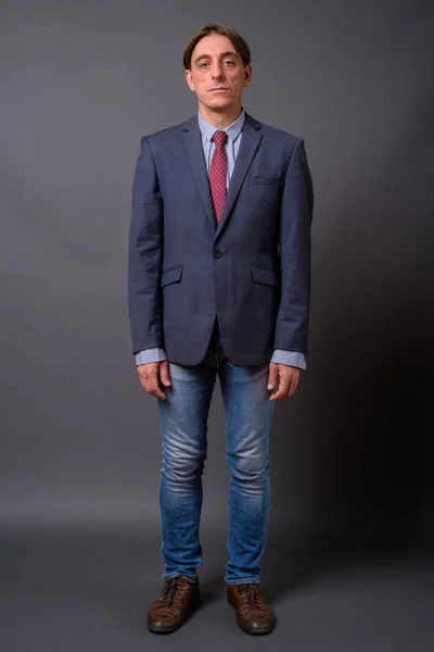 Full length shot of mature handsome Italian businessman standing — Stock Photo, Image