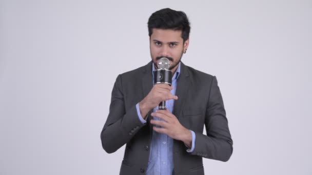 Young Indian businessman as newscaster making mistake — Stock Video