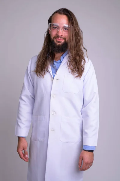 Ung bearded man läkare med skyddsglasögon — Stockfoto