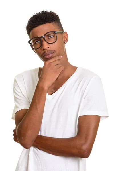 Young handsome African man thinking and looking up — Stock Photo, Image