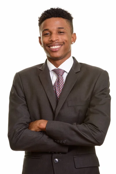 Joven empresario africano feliz sonriendo con los brazos cruzados — Foto de Stock