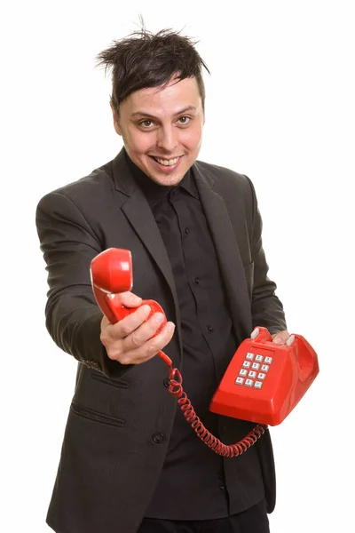 Studio skott av glad kaukasiska affärsman ger telefon — Stockfoto