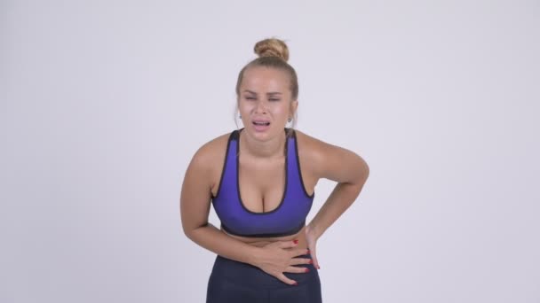 Stressed young blonde woman having stomach ache — Stock Video