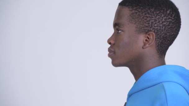 Closeup profile view of young handsome African man — Stock Video