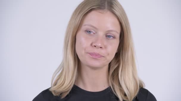 Face of young stressed blonde woman looking bored and tired — Stock Video