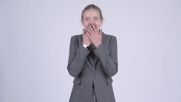 Young happy blonde businesswoman looking surprised — Stock Video