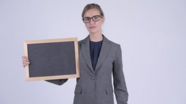 Genç işkadını blackboard tutarak aşağı Yaşasın vererek vurguladı
