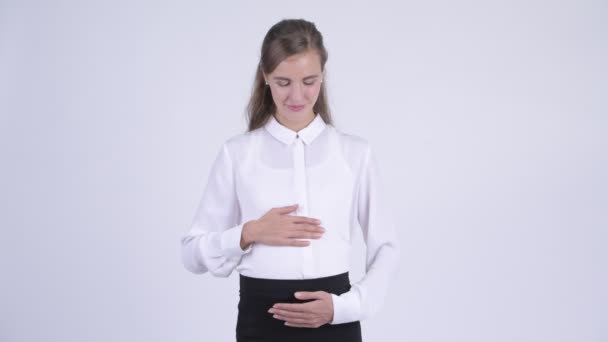 Young happy pregnant businesswoman looking excited while giving thumbs up — Stock Video