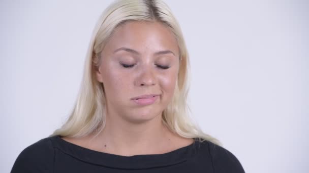 Face of young stressed blonde woman looking bored and tired — Stock Video