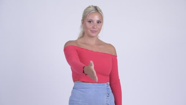 Happy young beautiful blonde woman giving handshake — Stock Video