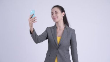 Mutlu genç güzel iş kadını video telefonu ile arama