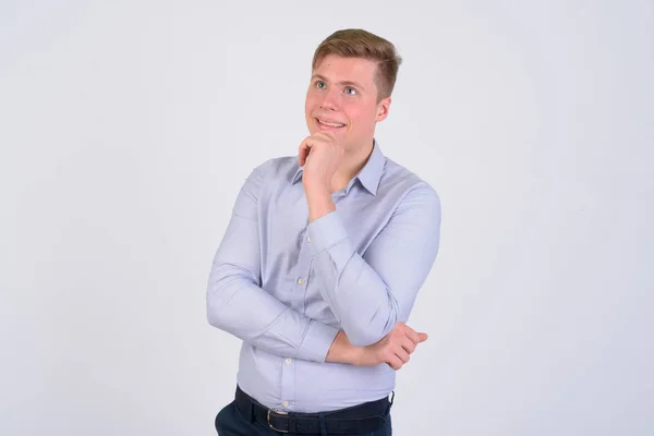 Portret van jonge gelukkig blond zakenman denken — Stockfoto