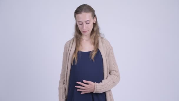 Ung stressad gravid kvinna ger tummen ner — Stockvideo