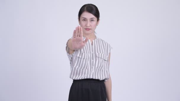 Serious Asian businesswoman showing stop gesture — Stock Video
