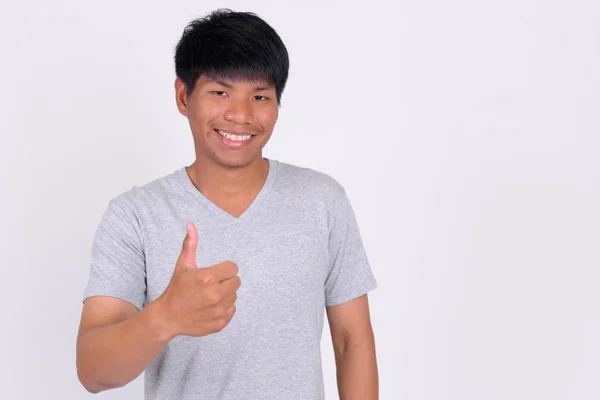 Retrato de feliz joven asiático dando pulgares hacia arriba —  Fotos de Stock