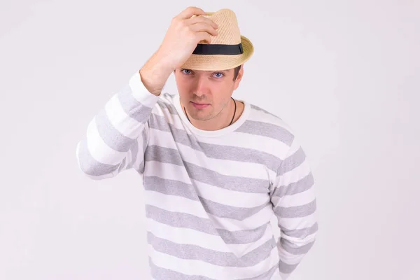 帽子を押しながら挨拶観光の男のポートレート — ストック写真
