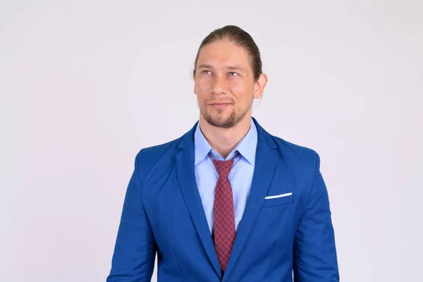 Portrait of happy businessman in suit thinking — Stock Photo, Image